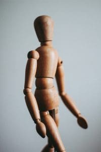Model wood doll representing the human body